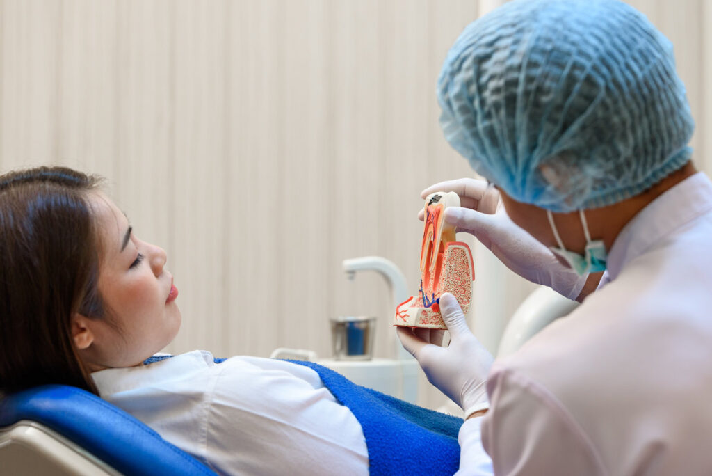Asian young women getting dentist consultation and Medical treatment at modern dental clinic or dentist office.